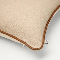 18"x18" Solid Chambray With Faux Leather Trim Square Throw Pillow Beige/Brown - Hearth & Hand™ With Magnolia 5 18"x18" Solid Chambray With Faux Leather Trim Square Throw Pillow Beige/Brown - Hearth & Hand™ With Magnolia -Hearth & Hand With Magnolia Shop GUEST 95a7c731 79dd 409c b1b1 c80ec9d336a2